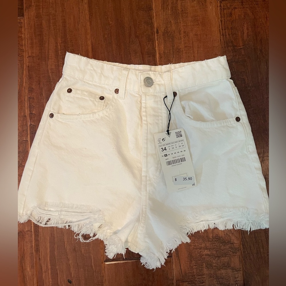 High waisted white distressed shorts